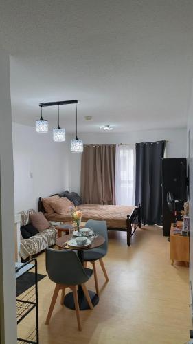 a living room with a couch and a table at Secret Nest in Manila