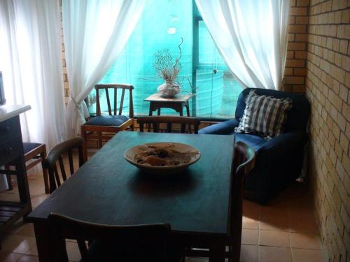 a living room with a table with a bowl on it at Timber and Tide in Cannon Rocks