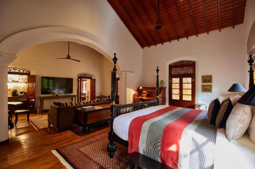 a bedroom with a bed and a living room at Maya Tangalle Luxury Wellness-Adults Only-Free Unlimited Shuttle service to our private Beach in Tangalle