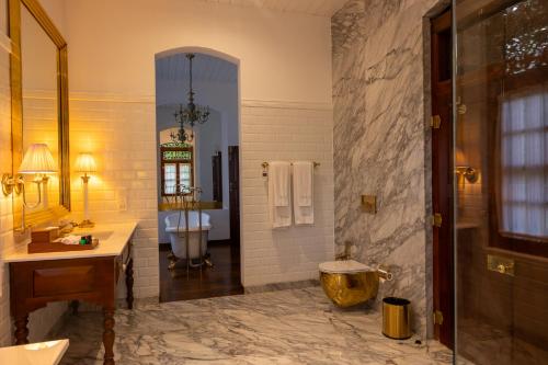 a bathroom with a shower and a sink and a tub at Maya Tangalle Luxury Wellness-Adults Only-Free Unlimited Shuttle service to our private Beach in Tangalle