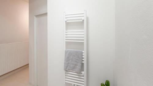 a white refrigerator with its door open in a room at Cosy loft near City Centre, Terra CasaMia in Antwerp