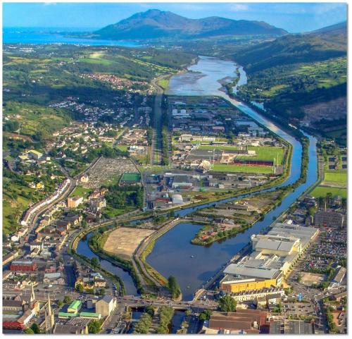 an aerial view of a city with a river at Park View Apartment Newry in Newry