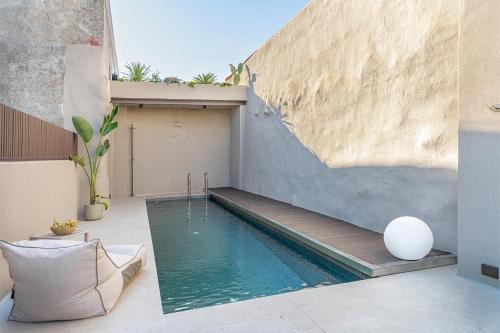 a swimming pool in the backyard of a house at Villa Villagio Rosso in Kókkinon Khoríon