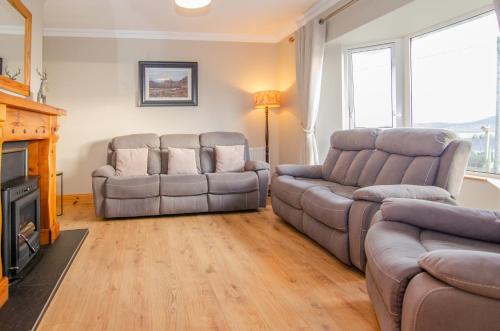 a living room with two couches and a couch at Sea View Heights in Rathmullan
