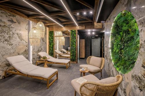 a waiting room with chairs and plants at Aparthotel Białka SKI, Odkryj-Bialke in Białka Tatrzańska