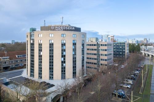 a building with a sign on the top of it at Hotel Nordseka The Hague - Voorburg in Voorburg