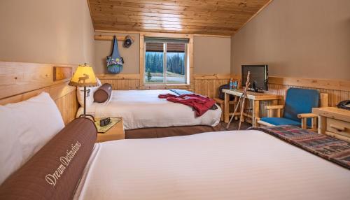 Voodi või voodid majutusasutuse Togwotee Mountain Lodge toas