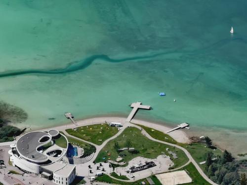 an aerial view of a church on the beach at Design Lake View Chalet, Urban Mountain Achensee in Maurach
