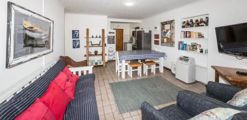 a living room with a couch and a table at Estuary Cottage in Sedgefield