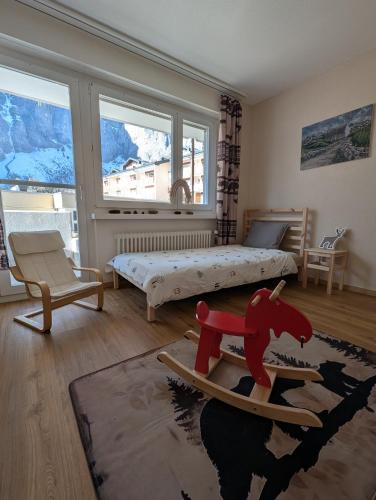 En eller flere senge i et værelse på Alpine Siesta