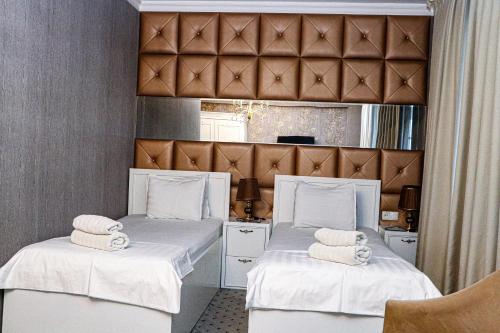 Llit o llits en una habitació de ORZU HOTEL