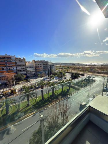 a view of a city with a street and buildings at The Convo Athens Riviera in Athens