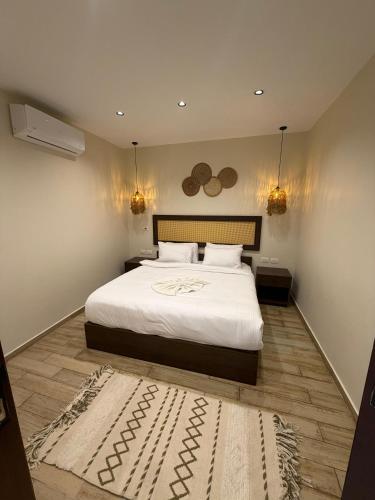 a bedroom with a bed and a rug on the floor at Solima pyramids inn in Cairo