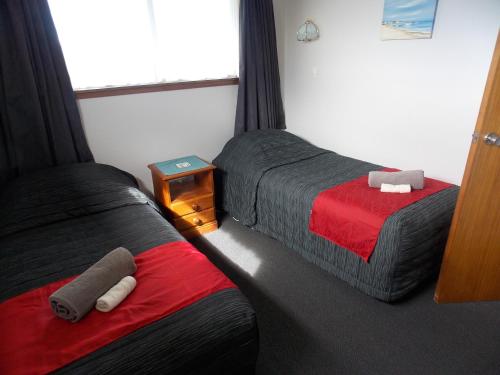 Postel nebo postele na pokoji v ubytování Rangiora Lodge Motel