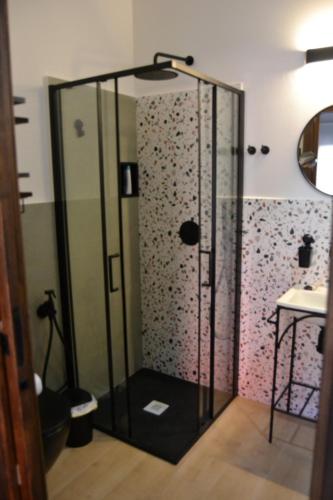a shower with a glass door in a bathroom at Mirador Esperabán in Aldehuela