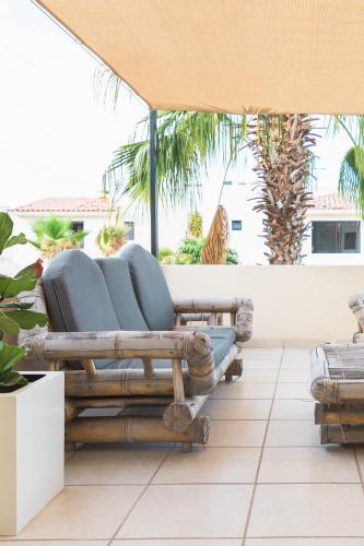 a group of chairs sitting on a patio at Outsite Los Cabos in San José del Cabo