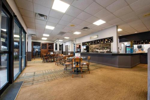 a restaurant with tables and chairs and a counter at 6165 Carrier Drive Unit 1802 Building 1 in Orlando