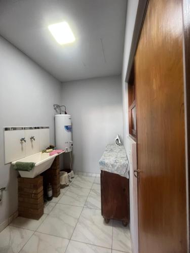 a bathroom with a sink and a toilet in it at Argerich in Eldorado