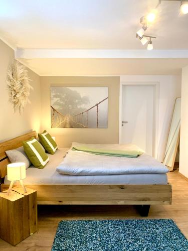 a bedroom with a bed with a bridge in the background at Zwei Apartments - ein Haus - Alles fußläufig - Altstadt, Wanderwege, Freibad und Restaurants in unmittelbarer Nähe in Schmallenberg