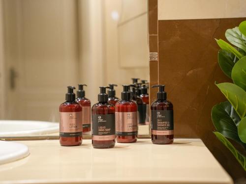 a group of bottles of wine sitting on a bathroom counter at Villa Alaya in Kos