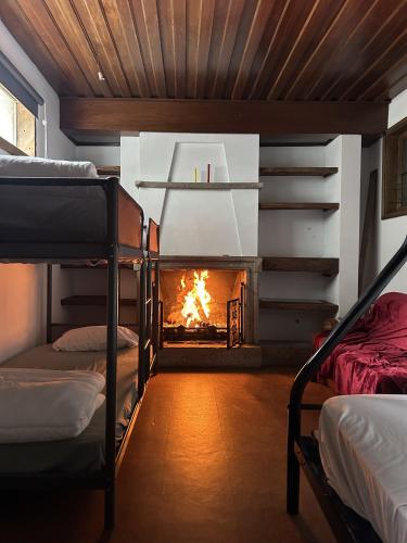 a room with a fire in a fireplace at Casa Quixote in Braga