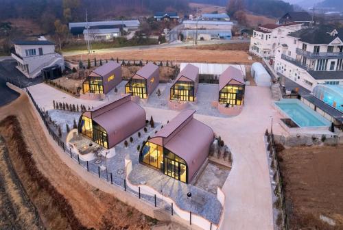 an overhead view of a building with lights on at Ganghwa Aiem Glamping in Incheon