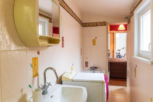 a small bathroom with a sink and a toilet at Maison familiale quartier Quentovic in Le Touquet-Paris-Plage