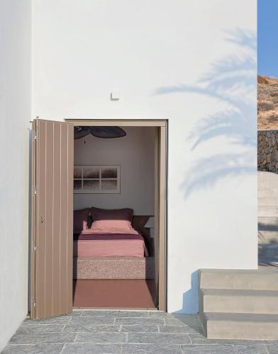 a small bedroom with a bed inside of it at Seriphos Estate in Serifos Chora