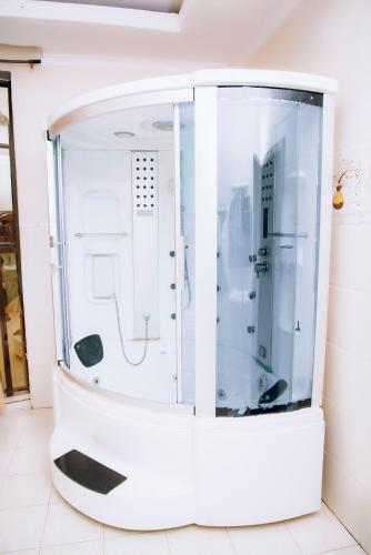 an empty room with a shower in a room at Stella nova motel in Kigali