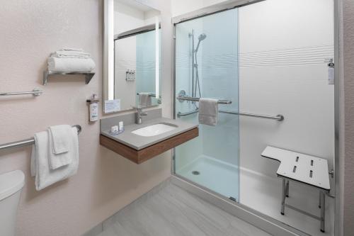 a bathroom with a sink and a shower at Candlewood Suites St. Robert by IHG in Saint Robert