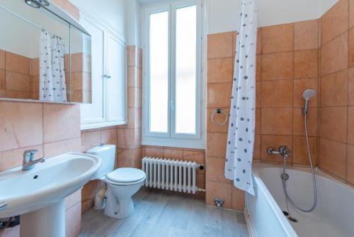a bathroom with a sink and a toilet and a shower at Happyfew maison Michelet in Nice