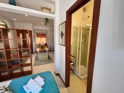 a view of a room with a mirror and a bathroom at Teatro Massimo - Apartment with a View of Theater Massimo in Palermo