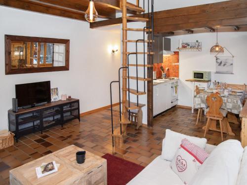 a living room with a couch and a table at Apartment Beau Site No 21 by Interhome in Ovronnaz