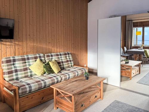 a living room with a couch and a table at Apartment Platten by Interhome in Gersau