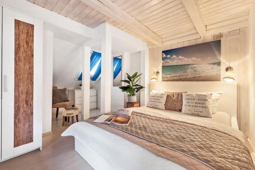 a bedroom with a large bed and a desk at Landhaus Sofie in Kreischa