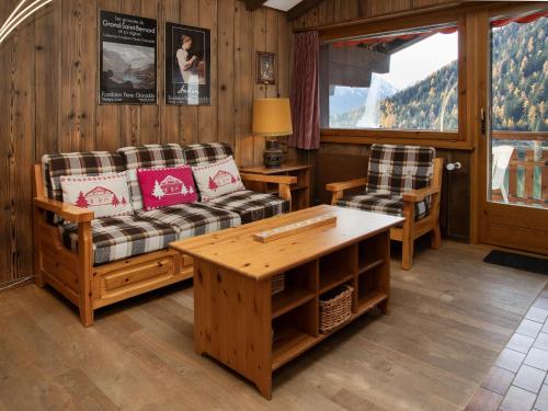 a living room with two couches and a table at Apartment Parc B 431 by Interhome in Champex