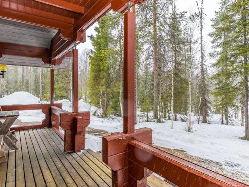 a porch of a cabin with snow on the ground at Holiday Home Revontuli by Interhome in Ruka
