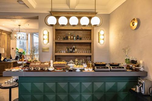 a buffet line with food on display in a restaurant at Hotel Casa Bianca by Faranda Boutique in Cartagena de Indias
