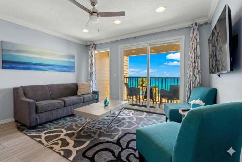 a living room with a couch and a view of the ocean at 410-Gorgeous Views, Waterfront, WIFI, Pool and close to BUCS Stadium in Tampa