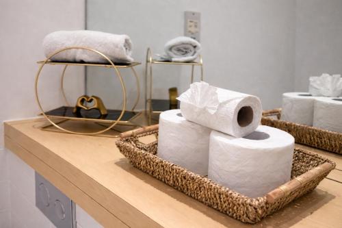 a pile of towels in baskets on a counter at Flat - Sleeps 4 - Parking - Balcony - Pet friendly in Sunderland