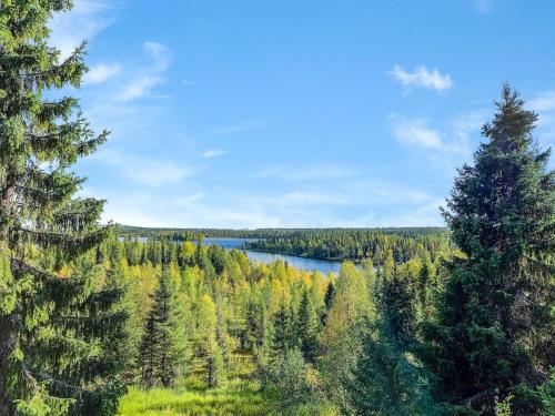 a view of a lake in the middle of a forest at Holiday Home Joutsen a by Interhome in Ruka