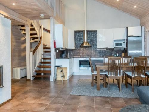 a kitchen and dining room with a table and chairs at Holiday Home Atrin suvanto a by Interhome in Levi
