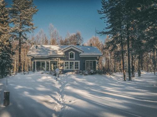a house in the snow in the woods at Holiday Home Ojala by Interhome in Virta