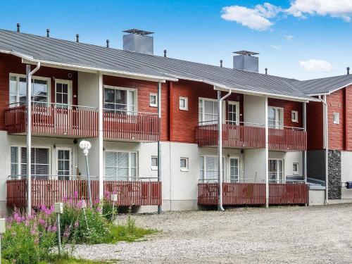 an apartment building with red and white at Holiday Home Levi star 2- as- 409 by Interhome in Levi