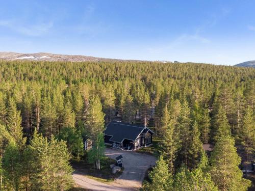 an aerial view of a cabin in the middle of a forest at Holiday Home Aspilevi by Interhome in Levi