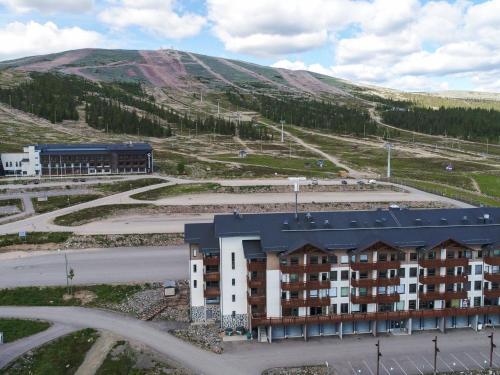 an aerial view of a building in front of a mountain at Holiday Home Ski chalet 6206 by Interhome in Ylläs