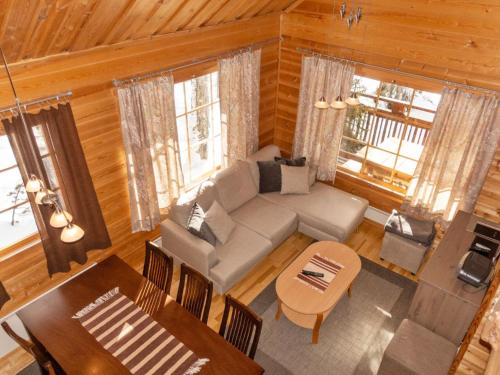 an overhead view of a living room with a couch and a table at Holiday Home Mervinrinne by Interhome in Luosto