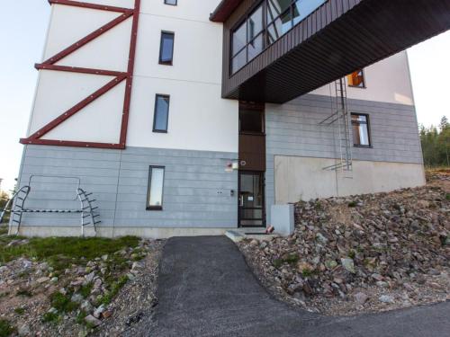 a building with a stairway leading up to it at Holiday Home Ylläs chalets 3207 by Interhome in Ylläs