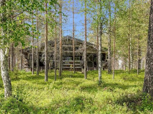 an old log cabin in the middle of a forest at Holiday Home Kulpakko 3 by Interhome in Tiainen