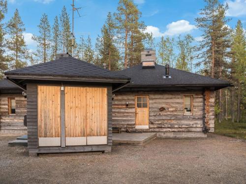 a log cabin with a door and a porch at Holiday Home Ylläsparit as- 2 by Interhome in Ylläsjärvi
